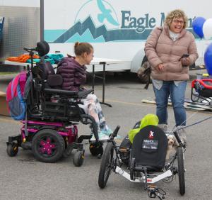 A youth in a wheelchair was surprised with her own sports equipment
