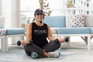 Image of Guide Pilar preparing for her fitness class to help enhance the health and wellness of older adults.