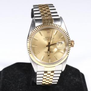 George McGinnis Rolex 18K yellow gold and stainless steel watch.