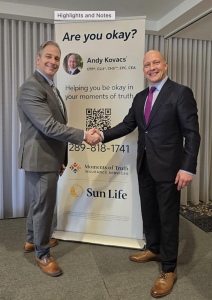 Chris Collucci, President and CEO of the Markham Board of Trade, and Andy Kovacs, President of Moments of Truth Insurance Services and Breakfast Series Sponsor, shaking hands in front of a promotional banner at the Markham Board of Trade Breakfast Network