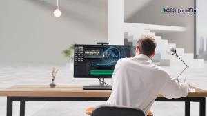 A user using the Lenovo ThinkCentre M90a Pro Gen 6 All-in-One, with Focusound Auto-tracking technology continuously adjusting the sound direction to keep the user in the optimal listening zone, no matter their position.