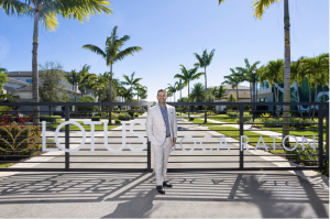 Misha Ezratti, President of GL Homes standing in front of the Lotus Boca Raton community.